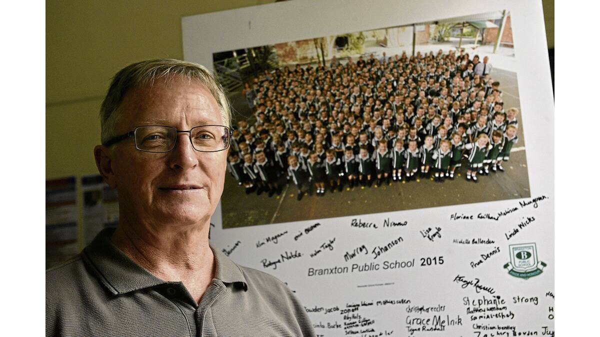 FOND MEMORIES:  Branxton Public School principal Mark Ouvrier says there have been major changes in technology during his career, but remaining close and in touch with the community is still a core value. 	Picture by STUART SCOTT