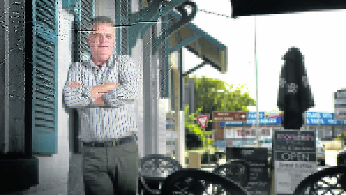 ‘DRACONIAN’:  Moreish Cafe owner Howard Bourne agrees with new anti-smoking laws but says it’s draconian for the state government to expect businesses to enforce it under threat of a $5500 fine.  	Picture by PERRY DUFFIN 