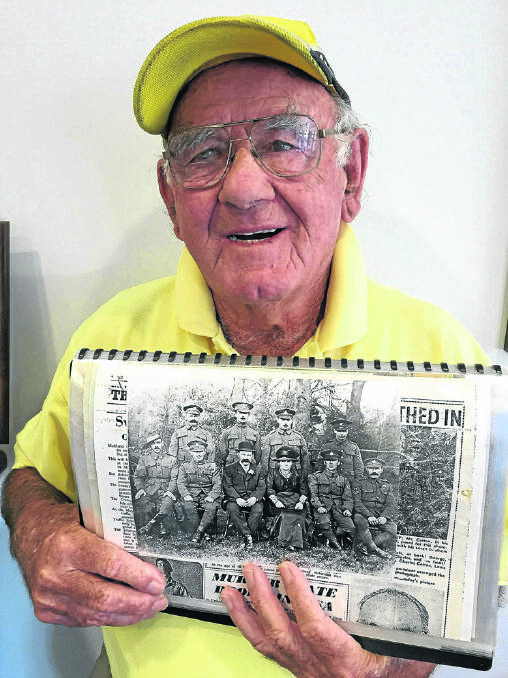 FAMILY FATE:  Rob Cotton wih the historic picture of his father and his seven brothers.  	Picture by ALAN HARDIE
