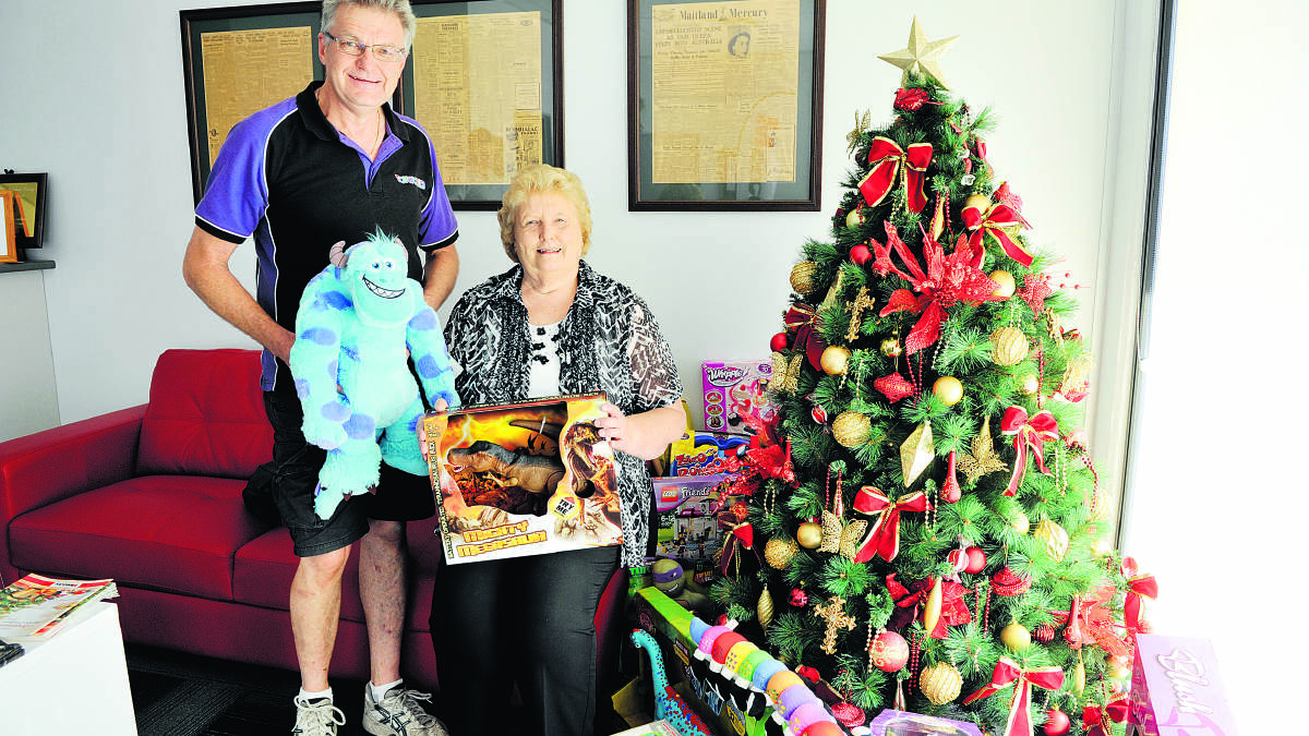 TOYS GALORE:  Our winner Rhonda Parker with Gareth Rodgers of Toyworld Maitland.  	Picture by CATH BOWEN 