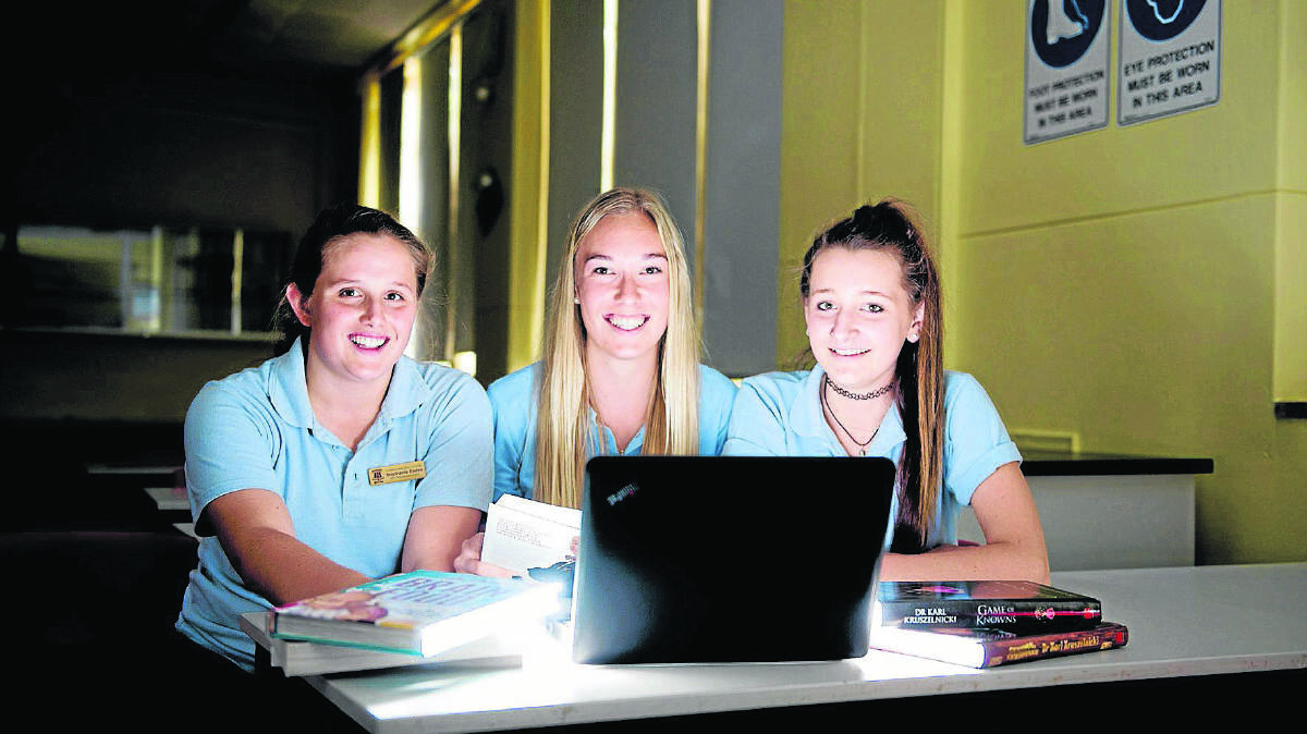 RESEARCH:  Kurri Kurri High School year 10 students Stephanie Eades, Mara Vogel and Ellie Everingham.  	Picture by PERRY DUFFIN