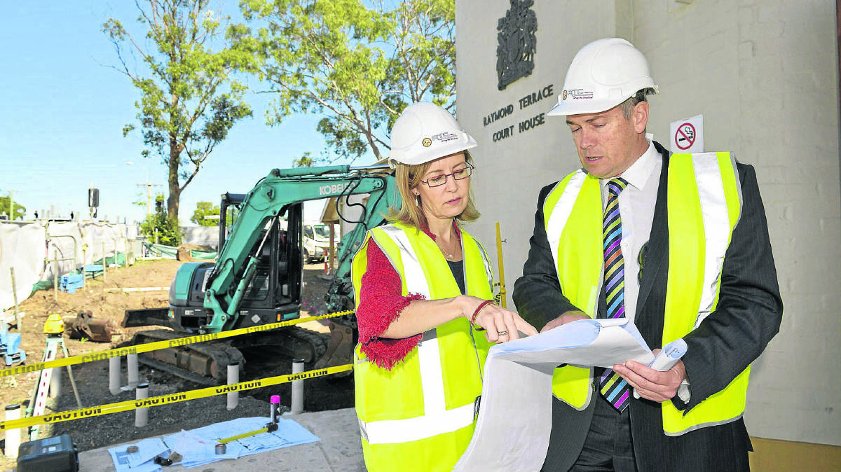 MAKING PROGRESS:  Attorney-General Gabrielle Upton looks over progress with Steve Honeywell of the Justice Department. 