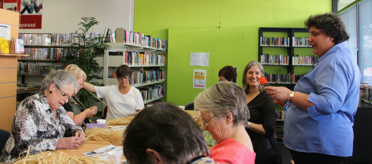 BASKET WEAVING: Michelle Earl and some of the participants from a previous basket weaving workshop at Cessnock City Library.