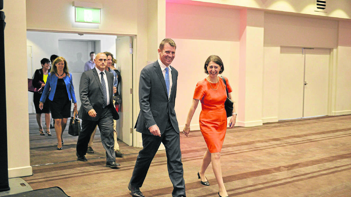 CONFERENCE CENTRE OPENING: Premier Mike Baird leaves the Crowne Plaza at Lovedale with Minister for the Hunter and Transport Minister Gladys Berijiklian.