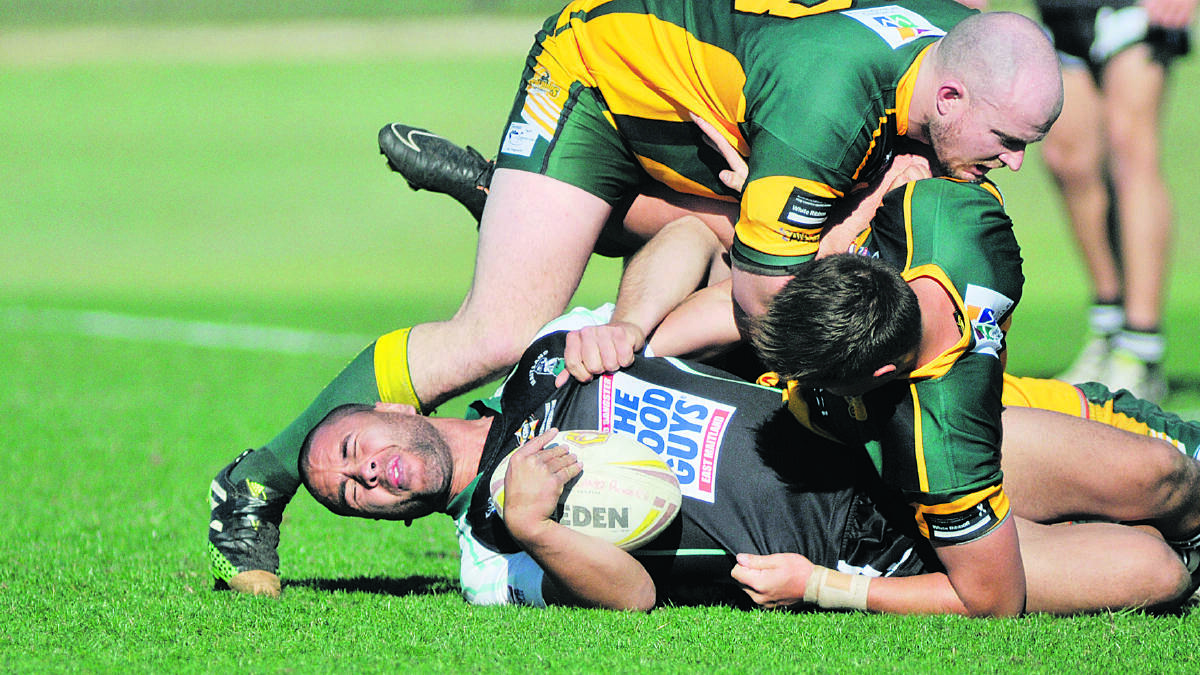 HARD LOSS:  Ngangarra Barber is hit in a heavy tackle.
Picture by CATH BOWEN