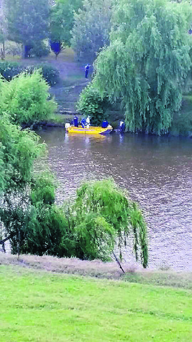 TRAGEDY:  Police at the scene where a woman’s  body was found floating in the Hunter River below Sempill Street on Sunday.