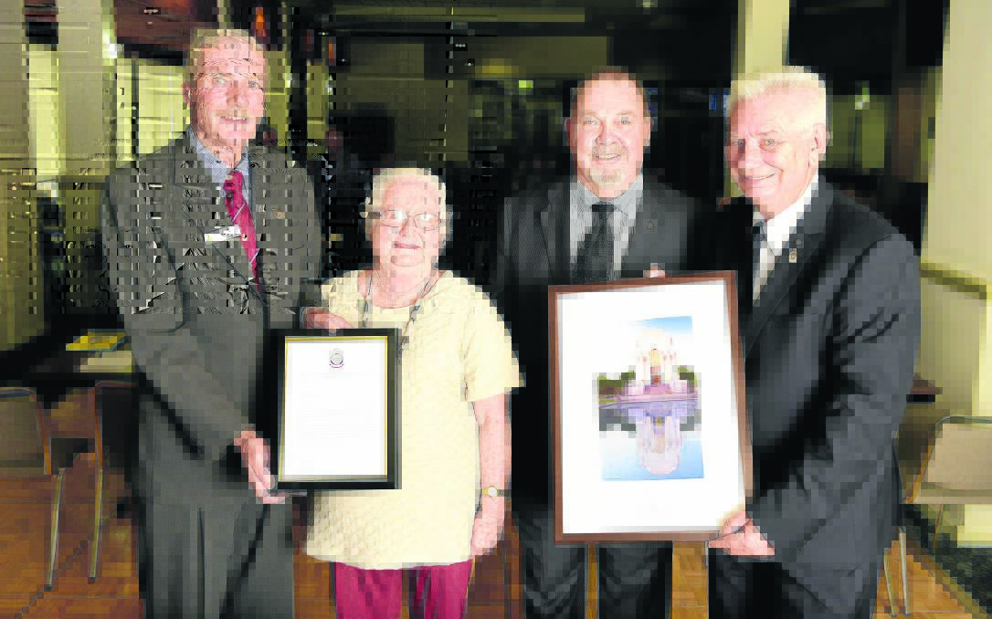 RECOGNISED:  Mary and Eric Bell (centre) receive their awards from Brian Boughton, President  of the RSL Hunter Valley District Council and Peter Stepherson, acting NSW RSL State president. Picture by PERRY DUFFIN 