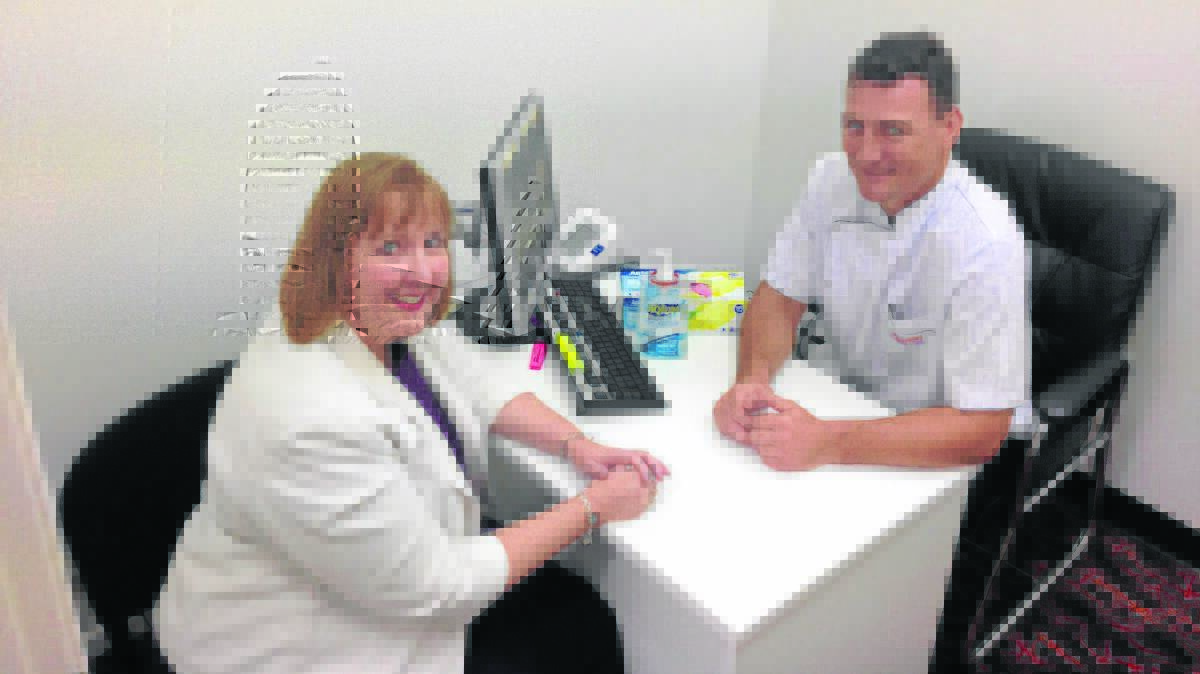 SUPPORT: Labor candidate for Maitland Jenny Aitchison speaks with Thornton Discount Drug Store owner and pharmacist Stephen Boyle. 	Picture by SAM NORRIS