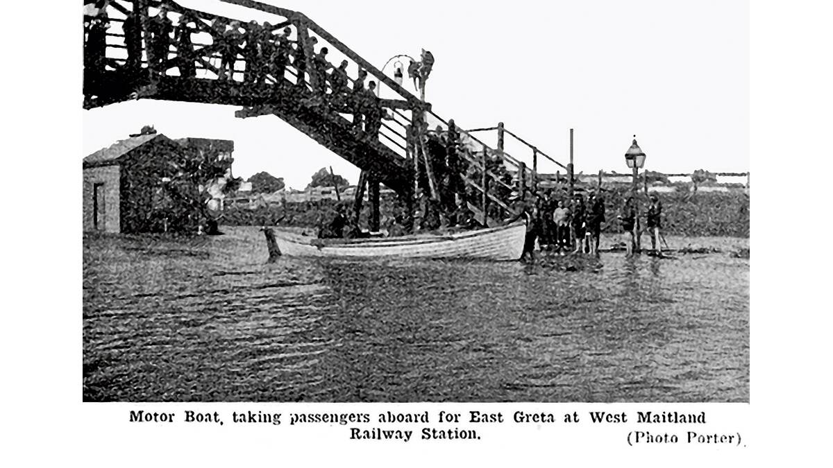 DIFFICULT TIMES: A motor boat takes passengers aboard at West Maitland Station in 1913.  