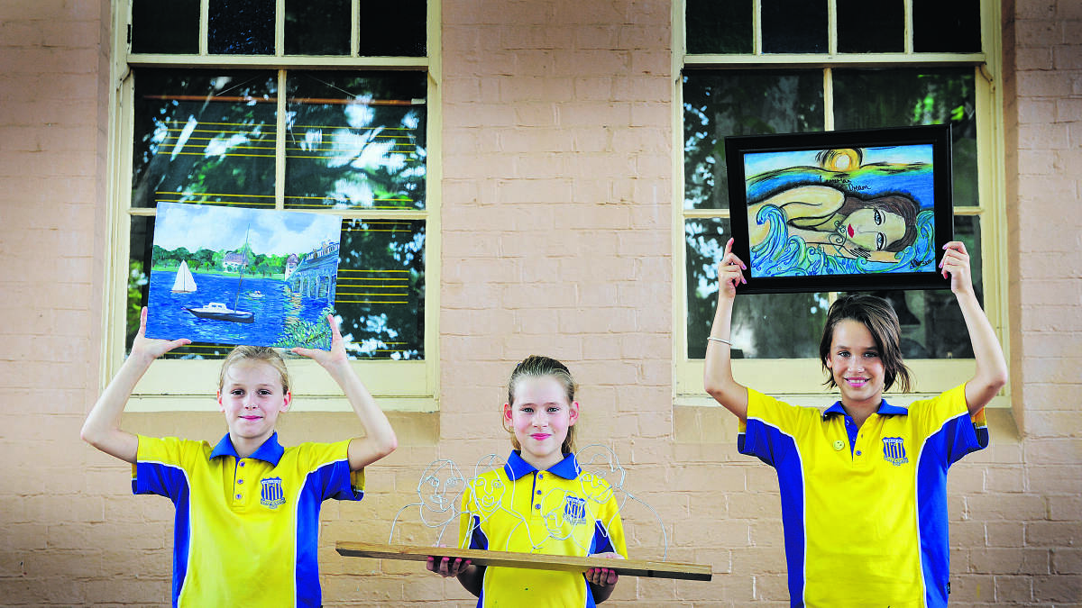 CREATIVE FLAIR:   Emmerson Hewitt, 10, Elizabeth Hall, 10, and Monica MacCann, 11, with their works that will be auctioned to raise money for their school.   	Picture by CATH BOWEN 