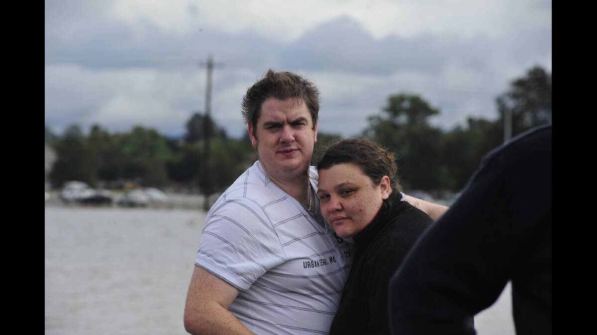 WITNESS:  Stacey Wilcher of Gillieston Heights is comforted by a friend at Fishery Creek ­yesterday.  	Picture by CATH BOWEN 