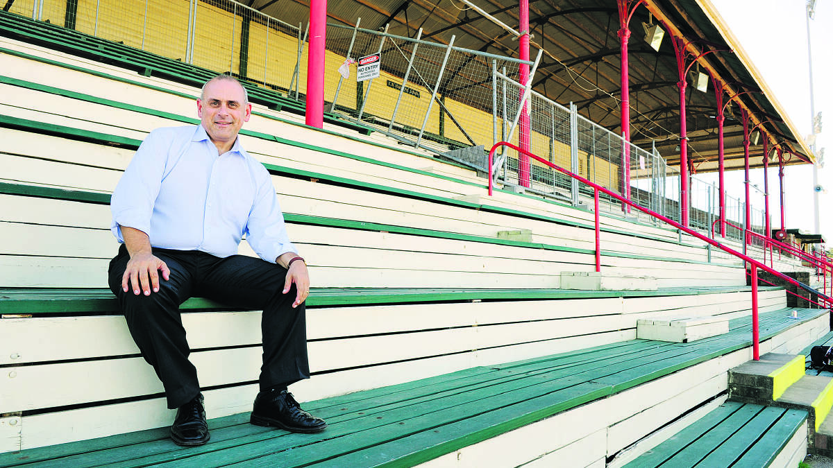 A PIECE OF MAITLAND’S HISTORY:  Liberal candidate Steve Thomson says saving the grandstand has been an issue close to his heart. 	Picture by CATH BOWEN 