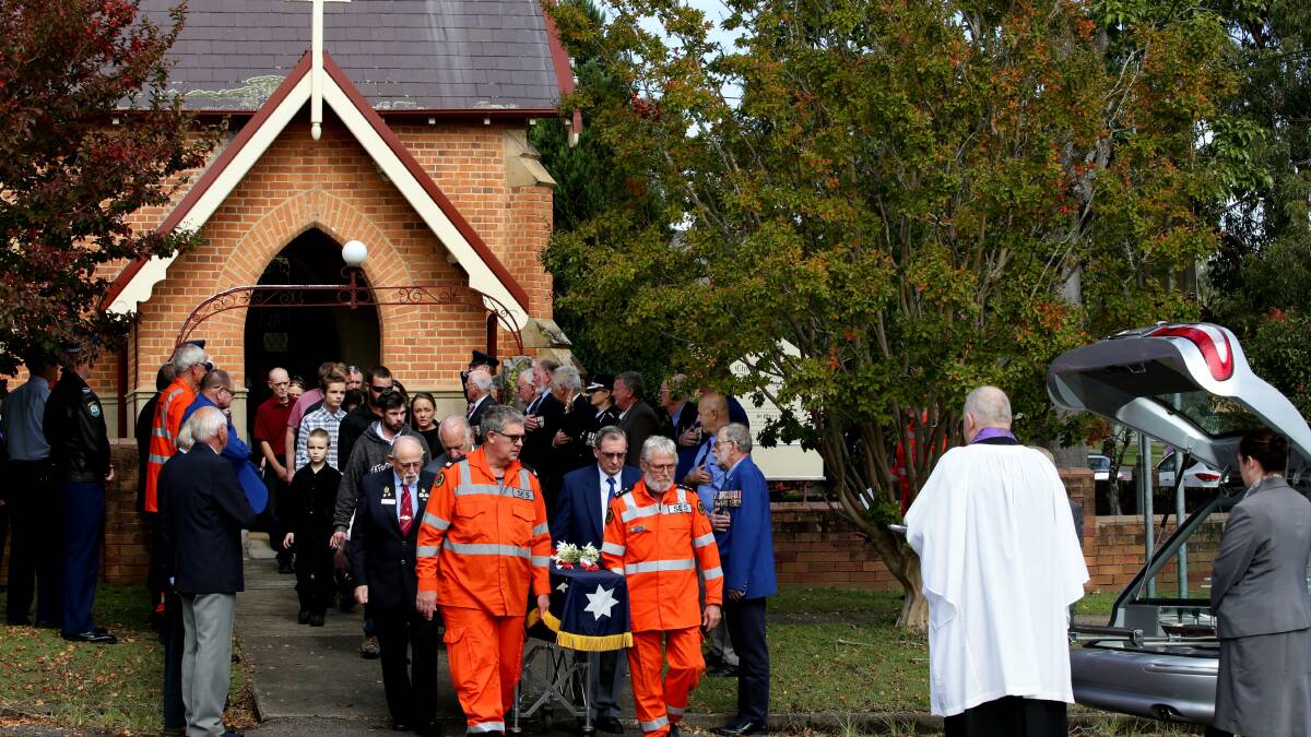 DUNGOG MOURNS:  The coffin of Brian Wilson is carried from the church.  	Picture courtesy Newcastle Herald