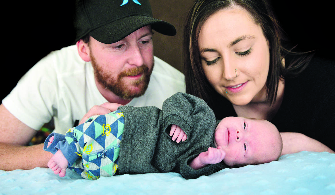 MIRACLE BABY:  Montana-Jade Jenner and Peter Burl with surviving twin Slade.	Picture by CATH BOWEN