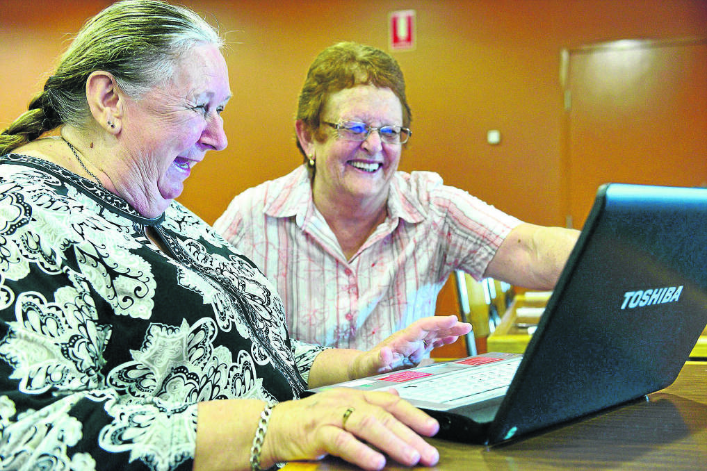 NEW SKILLS:  Carolyn Quinn of Beresfield with Computer Pals Maitland president Coral Cox.