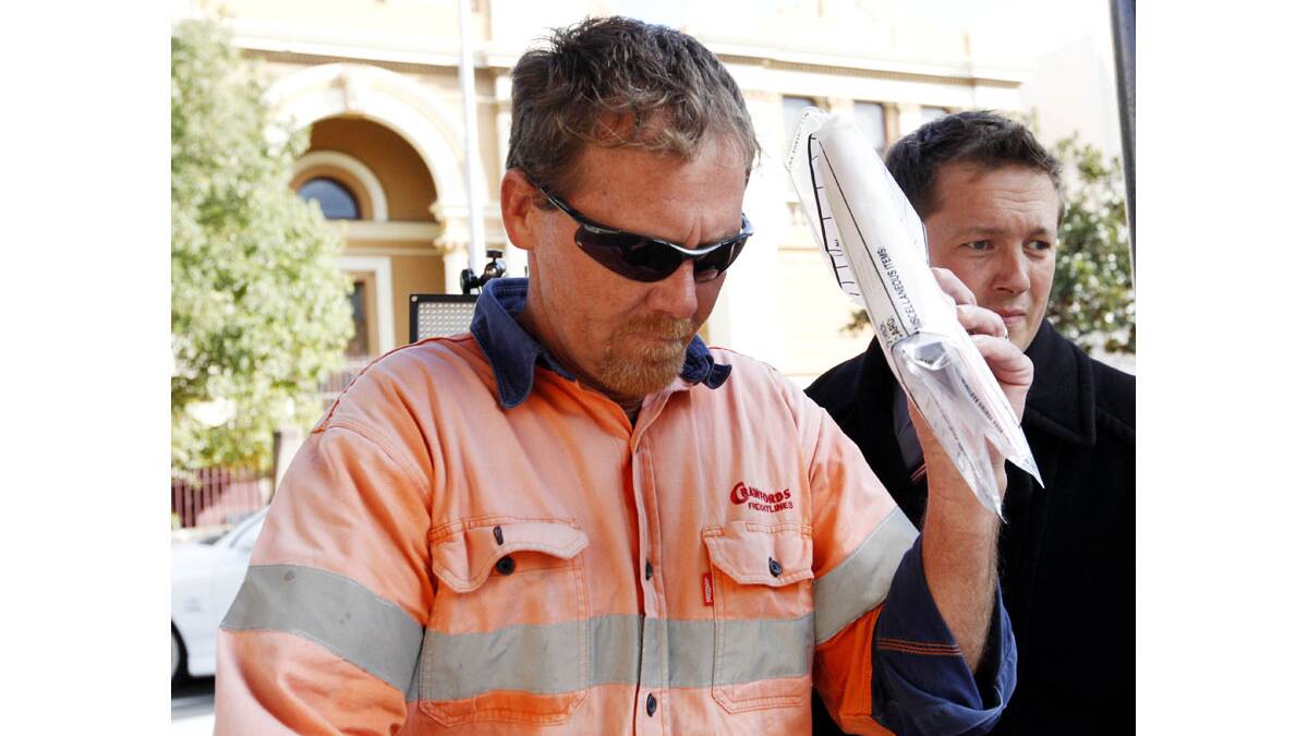 OUT ON BAIL: Warabrook man Geoffrey Michael Strong leaves Newcastle Local Court after being released on bail on Wednesday, accused of manslaughter. Picture by DARREN PATEMAN