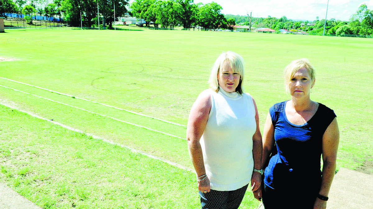 DISAPPOINTED FOR THE KIDS:  St Patrick’s Primary Shool P&F secretary Jan Ihlein and president Bettina Chandler believe the ground is a health hazard.  	Picture by CATH BOWEN