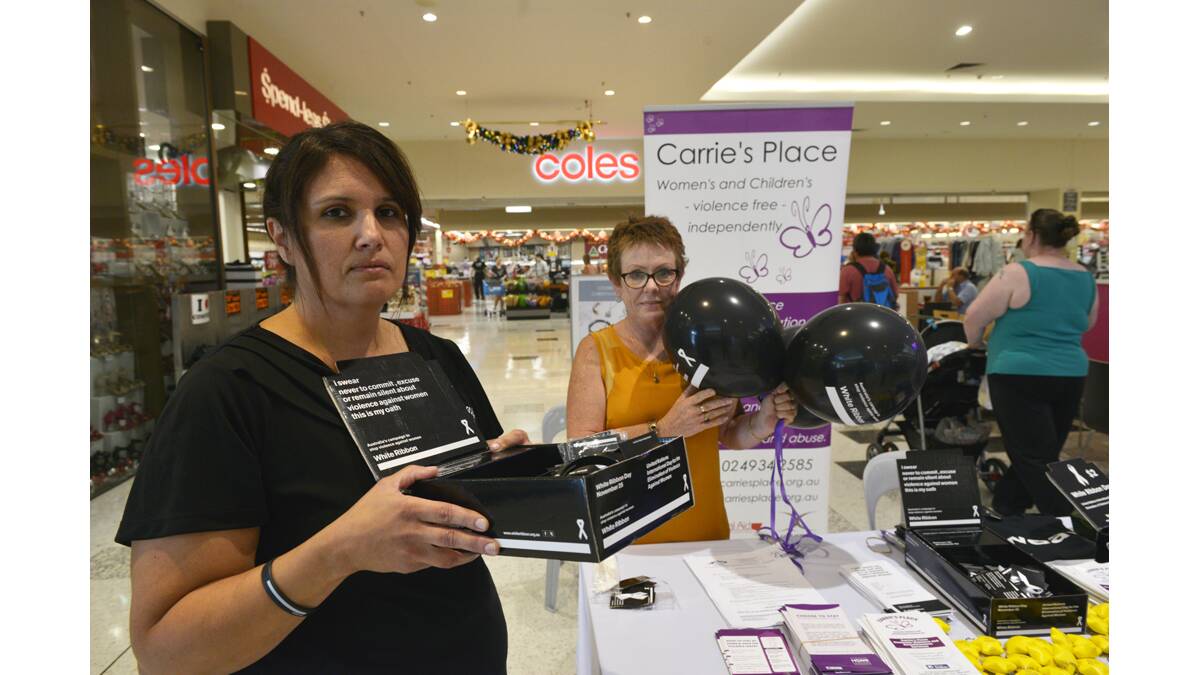 SUPPORT:  Karen Peckham and Elizabeth Richards sell White Ribbon merchandise at Green Hills shopping centre.