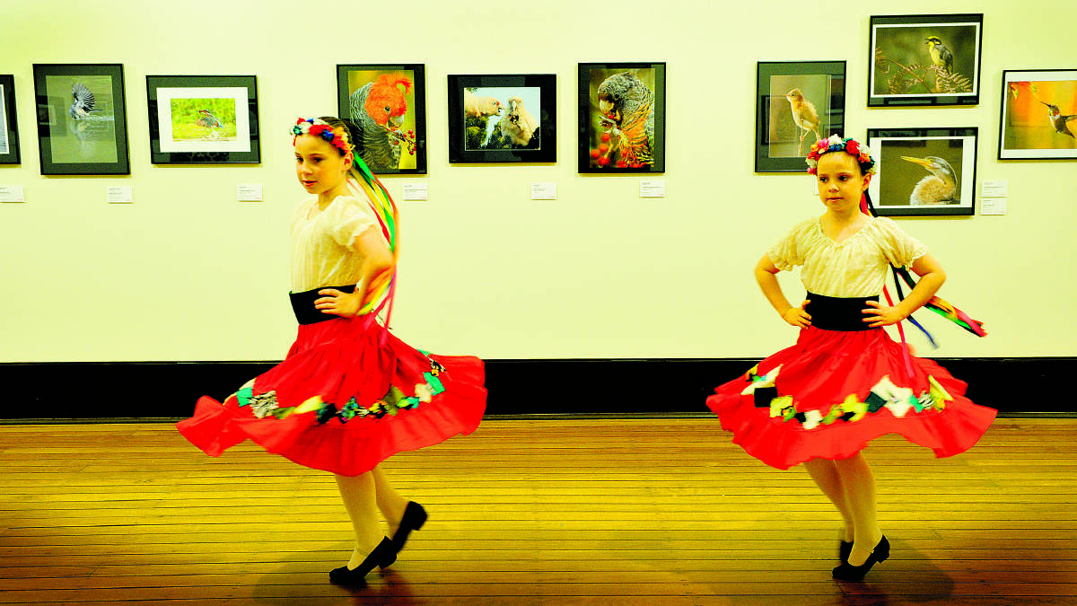 SUPPORT ACT:  Maitland Jewish dancers Maddison and Kaitlin Holbent go through their paces at Maitland Regional Art Gallery.   	Picture by CATH BOWEN 