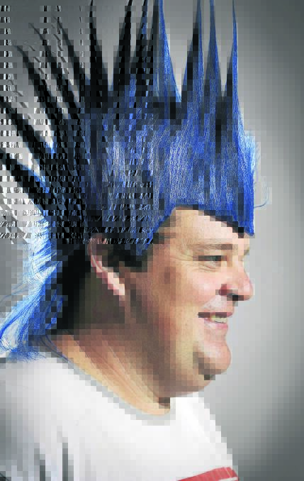CHALLENGE: Shane Hill tries on a blue wig ahead of his most ambitious cancer fundraiser. He will keep his hair dyed blue during March and also host a community  fun day at Rutherford.
	Picture by PERRY DUFFIN