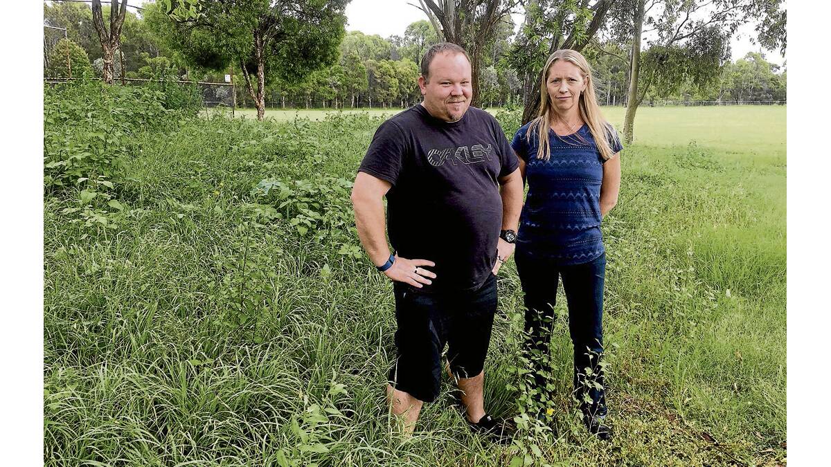 BEFORE AND AFTER: East Maitland Little Athletics president Nathan Whyte-Southcombe and secretary Megan Price inspect the long grass at Metford oval.  	Picture by ALAN HARDIE