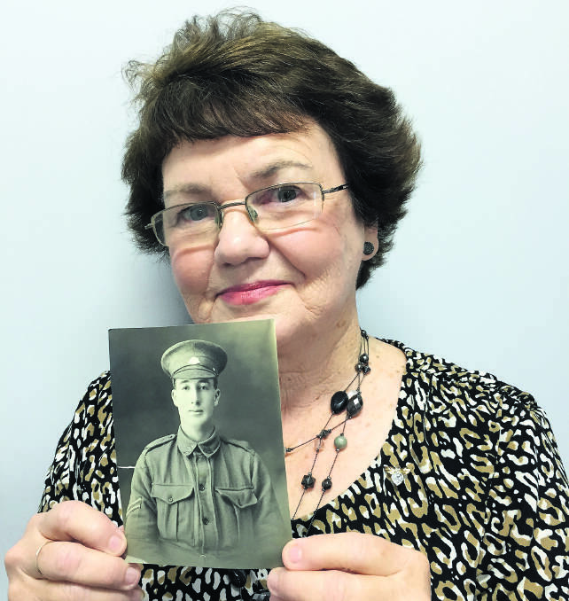 Fay Andrews of Bolwarra Heights with Lieutenant Stanley Garnham's picture. 
