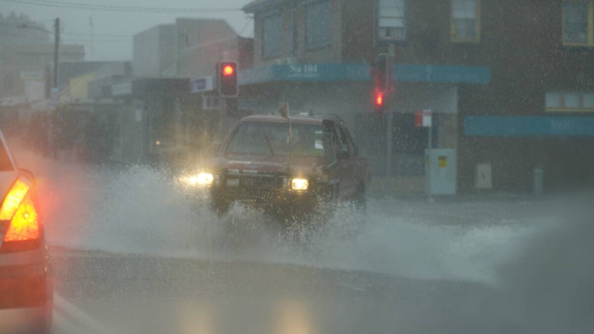 HEAVY GOING: The corner of Lawes and High streets, East Maitland on Wednesday.  	Picture by STUART SCOTT