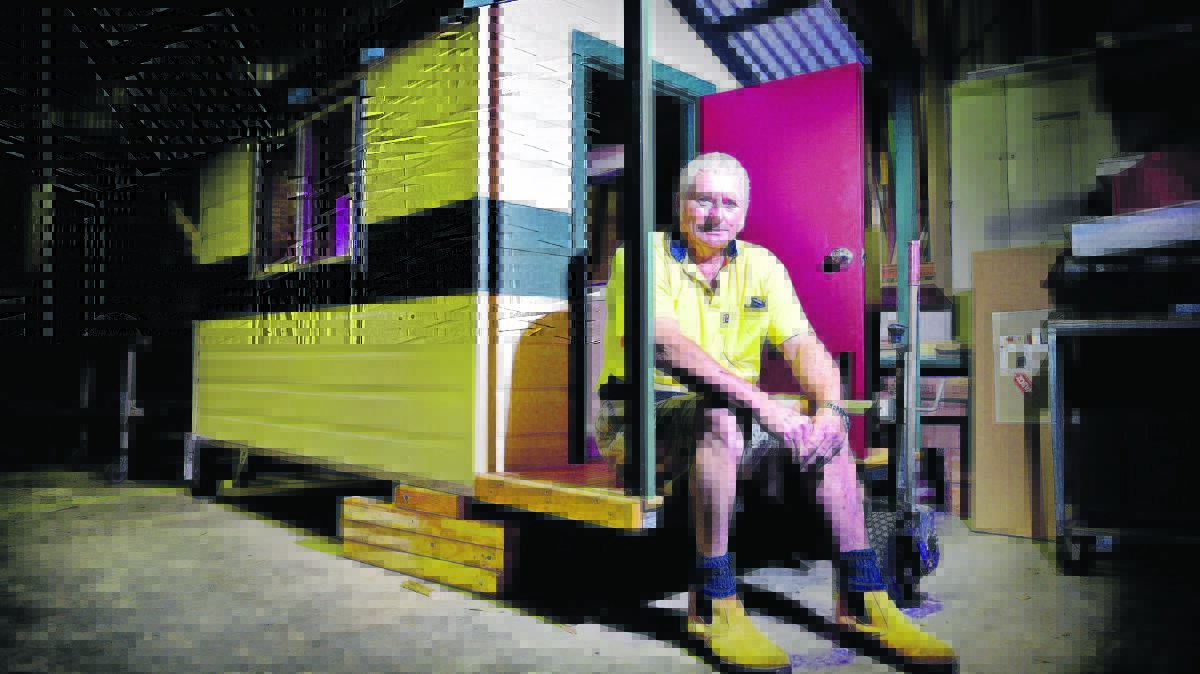 CHRISTMAS PROJECT: Men’s Shed member Tom Norton with the cubby house.