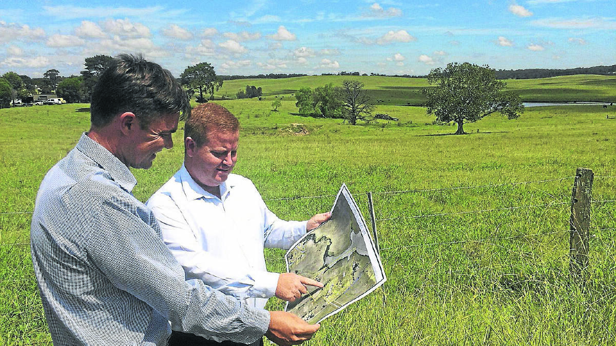 SITE POTENTIAL:  Hardie Holdings development manager Jamie Bosswell looks over the plans for the site with Cr Philip Penfold.   	Picture by NICK BIELBY 
