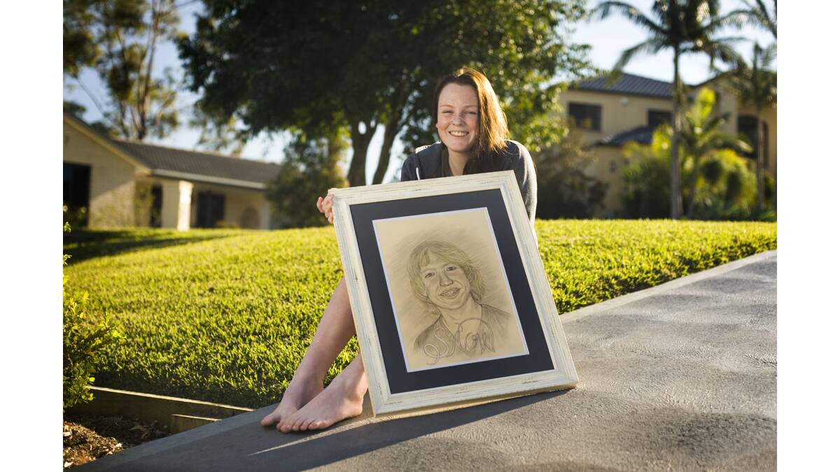 SPECIAL TRIBUTE:   Marnie Pobjie, part of Team Snow, with a portrait of her brother Jonte. 	Picture by PERRY DUFFIN  