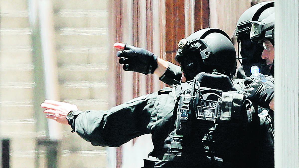 FULL ALERT:  Tactical response team members were out in force in Martin Place yesterday.	 