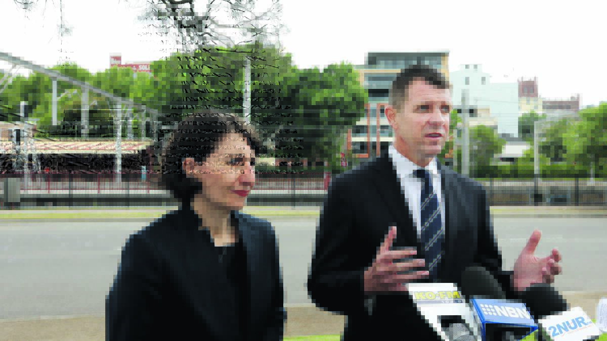 NEWS CONFERENCE:  Transport Minister Gladys Berejiklian and Premier Mike Baird in Newcasle yesterday.