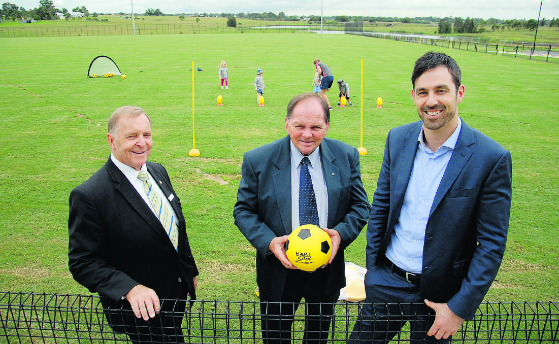 HANDOVER: Councillor Henry Meskauskas and Mayor of Maitland, Cr Peter Blackmore inspect the Aberglasslyn oval with Stockland regional manager Stephen Barlow.   