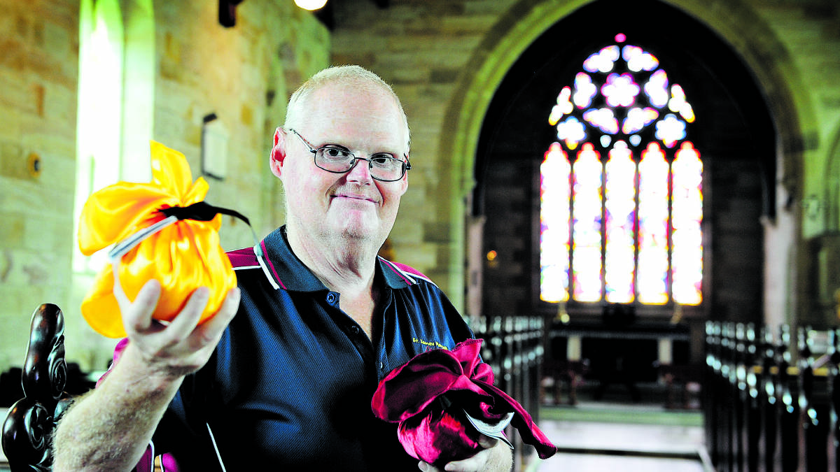 TASTY TRADITION:  St James’ Anglican Church member David Baldwin tempts pudding fans’ taste buds with the forbidden delights.		Picture by CATH BOWEN 
