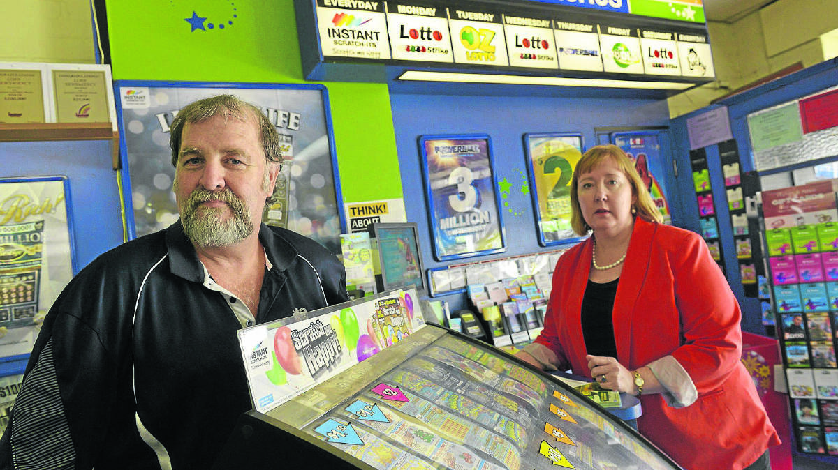 UNIMPRESSED:  Lorn newsagent Rod King with Labor candidate Jenny Aitchison who is against the proposed changes that she believes would make newsagents vulnerable.   	Picture by STUART SCOTT