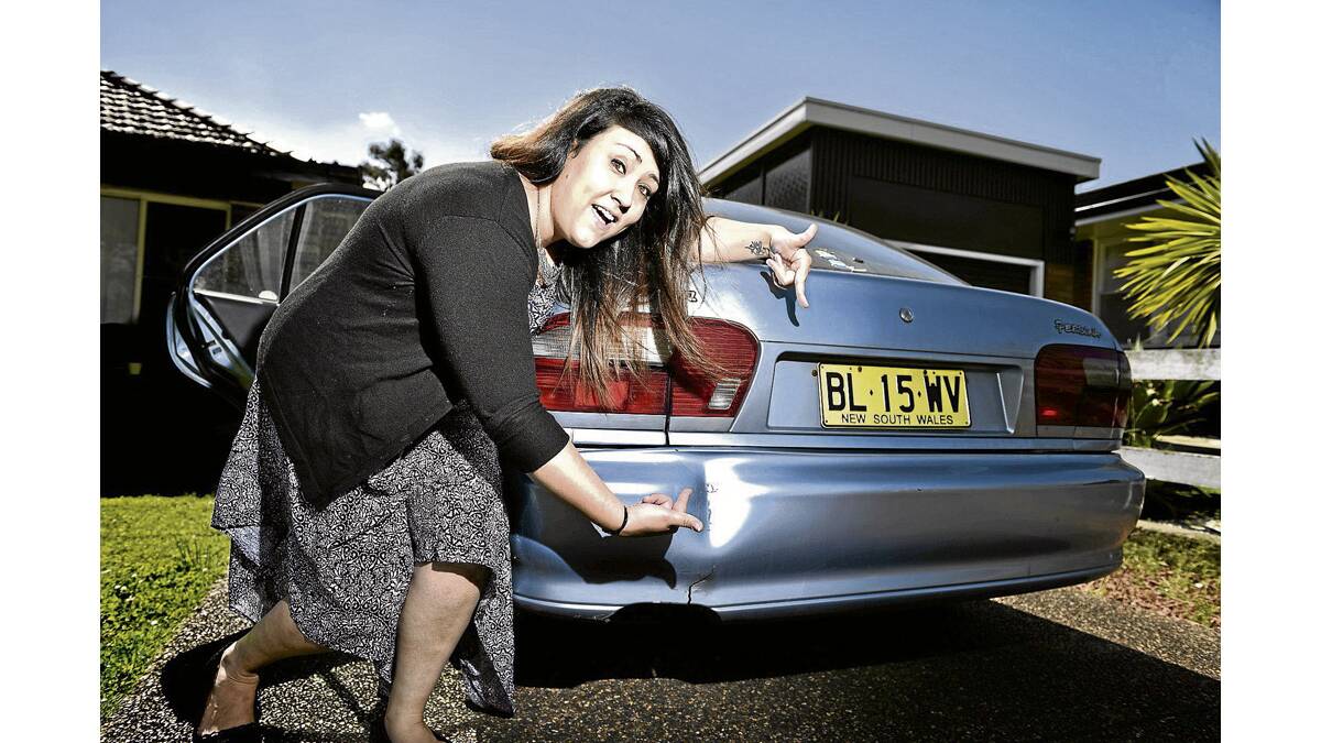 HONEST TO A FAULT:  Melanie Dyer with her “shitbox” car that’s on the market.   	Picture by PERRY DUFFIN 