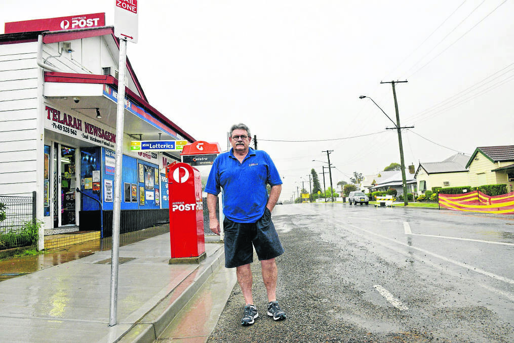 REMAINING POSITIVE:  Bruce Toghill of Telarah Newsagency says the ongoing works are all for the better.	Picture by STUART SCOTT 