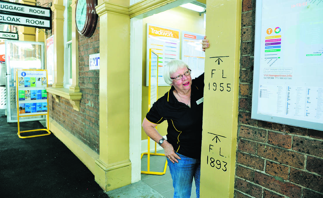 REPLACE THEM:  Lynette Huckstadt  with one of the remaining 1955 flood level signs at Maitland railway station. 	Picture by CATH BOWEN 