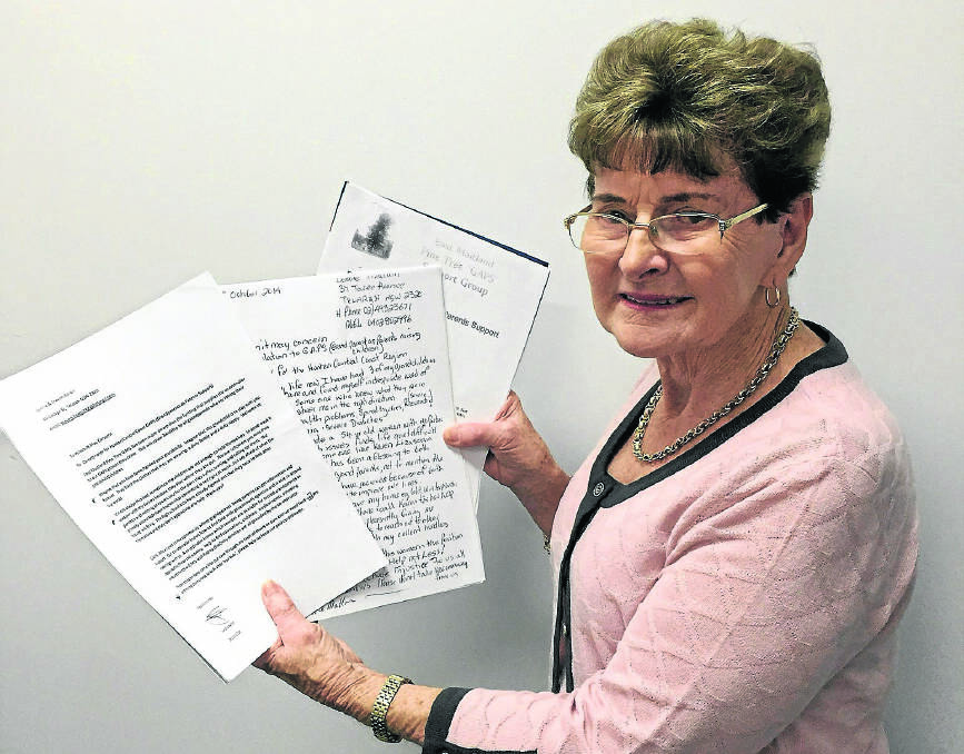 GRANDPARENTS NEED HELP:  Bev Steggles with some of the letters she has received from grandparents and the federal ­government.   	Picture by ALAN HARDIE 