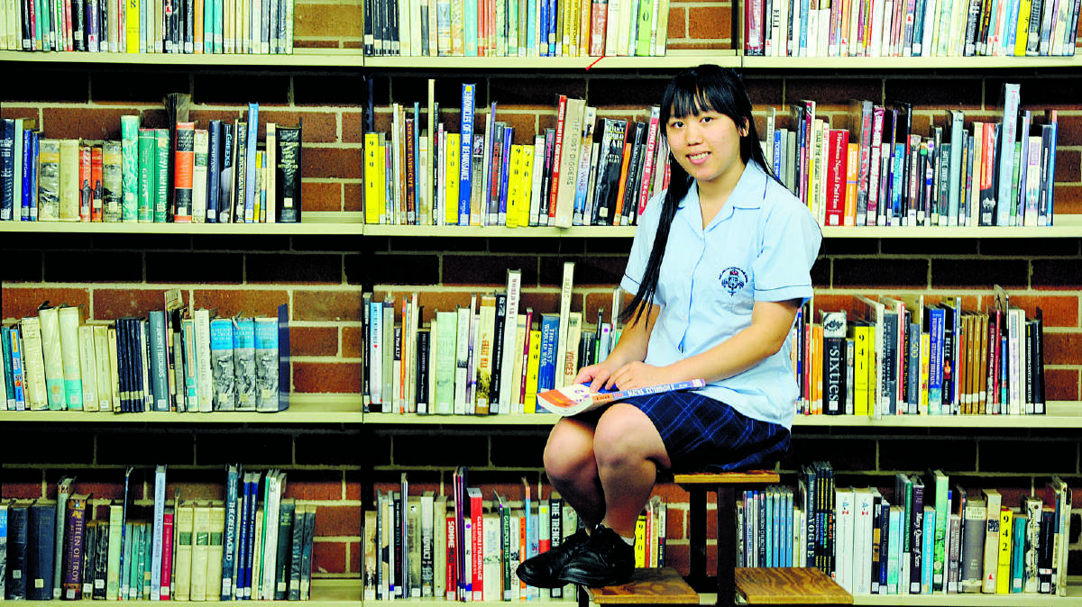 OUTSTANDING RESULTS:  Jing Xhou has excelled in her studies at Maitland Grossmann High School since coming to the city last year.  				Picture by CATH BOWEN 