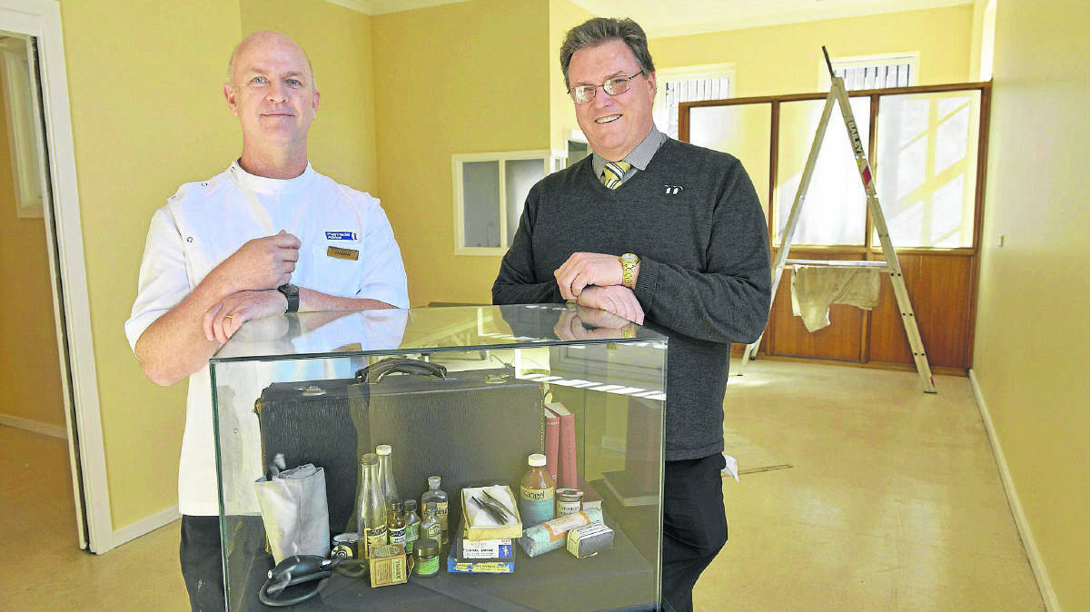 SINISTER GADGETS:  Tenambit pharmacist Glenn Rose and Maitland Gaol co-ordinator Gordon Sauber with part of the medical display.	Picture by STUART SCOTT