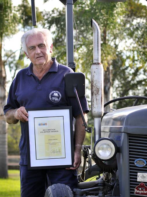 AWARD:  John Green whose passion is restoring old tractors.  