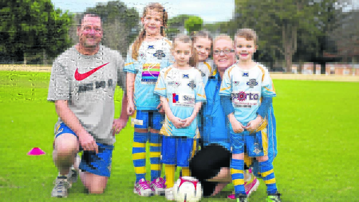 FOOTBALL FOR ALL:  Coaches Heath Schiemer and Kim Williams with the Maitland Football For All under-6s.  	Picture by PERRY DUFFIN 250615PD0103