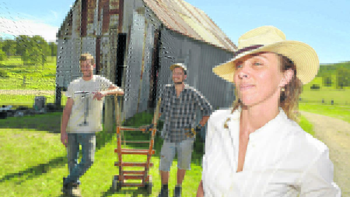 VILLAGE LIFE: Lucie Bruvel (front) with Shepherds Ground residents Marco Forman and Nels Bjarke.  Picture by STUART SCOTT