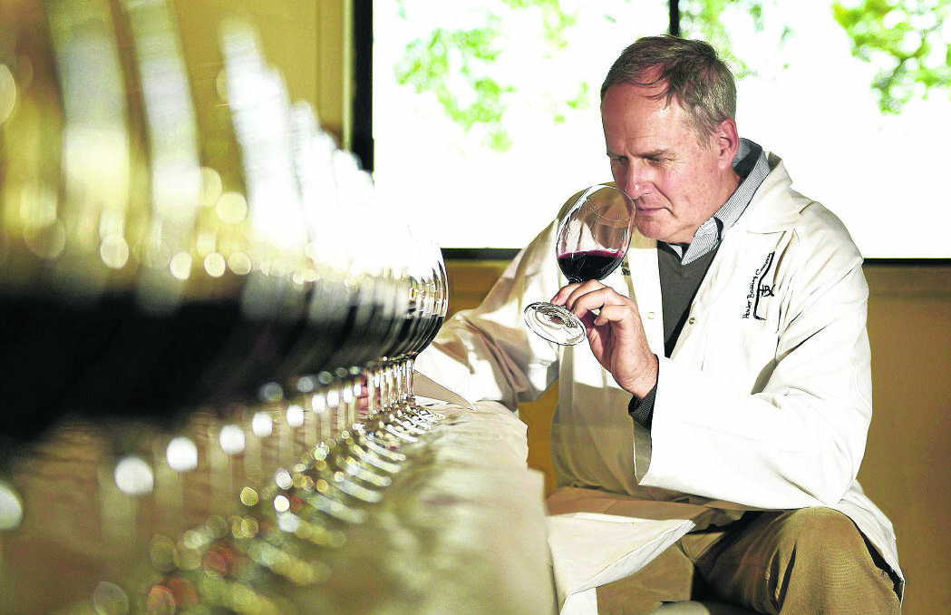 HARD AT WORK:  Chairman of judges Keith Tulloch says the 2014 vintage will go down as a very strong one in the Hunter Valley with some outstanding wines produced. Picture by PERRY DUFFIN