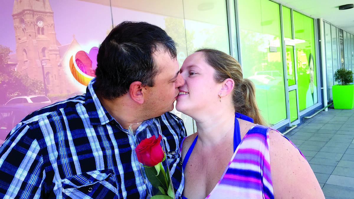 KISS AND MAKE UP:   Luke Moran and Kellie Swan.  	Picture ALAN HARDIE