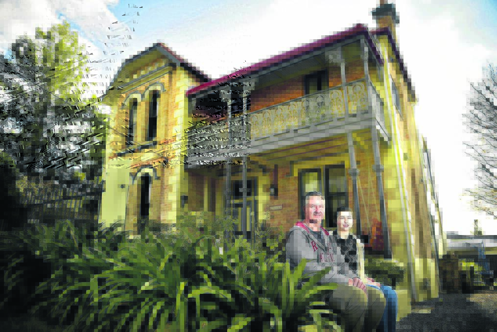 INFORMATION PLEASE:  Terry Knight with his daughter Chelsea at his Narang Street home.    	Picture by PERRY DUFFIN 
