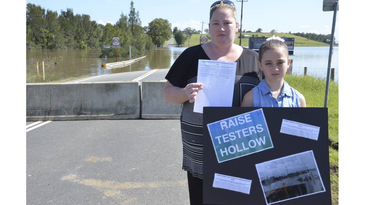 ENOUGH IS ENOUGH:  Raiser Testers Hollow petition organiser Sonia Warby of Cliftleigh, pictured with her daughter Kirra-lea, says she sees funding go to other local projects, but not Testers Hollow. 
Picture: Cessnock Advertiser