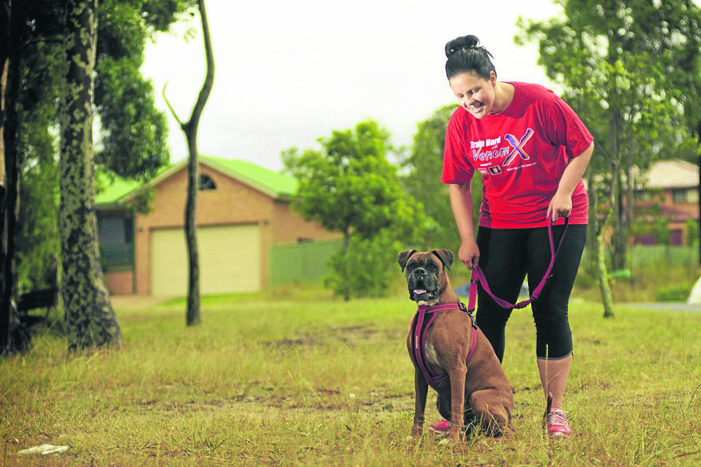 LIFE HAS CHANGED DRAMATICALLY:  Kate Roberts with her dog Nitro, which she used to walk every day. 
