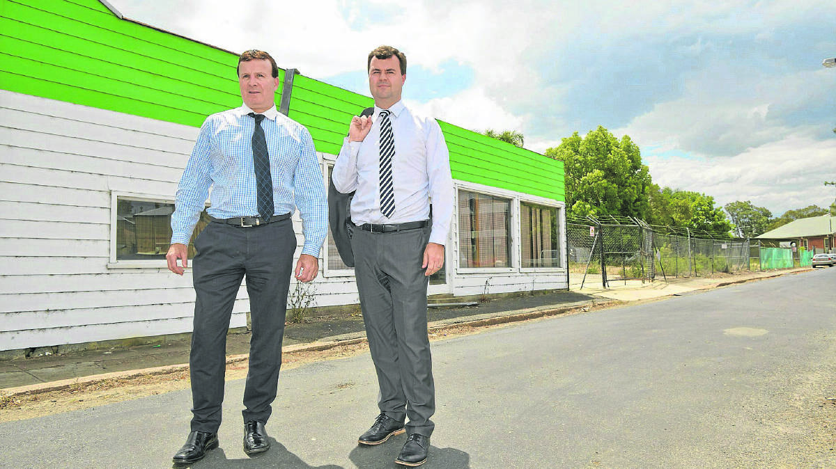 AFFORDABLE HOUSING:  Maitland Newcastle Catholic diocese representatives Boyd McCallum and Sean Scanlon inspect the proposed site for nine townhouses. 	
	Picture by STUART SCOTT